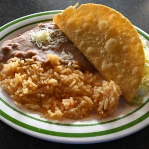 Kids #3. Beef Taco served with rice and beans.